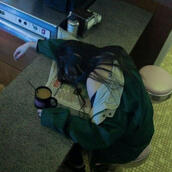 Picture of a girl sleeping on a book.